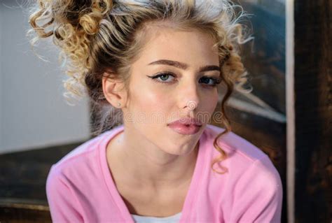 blonde with curly hairstyle and red lips beautiful model with curly hair fashion haircut