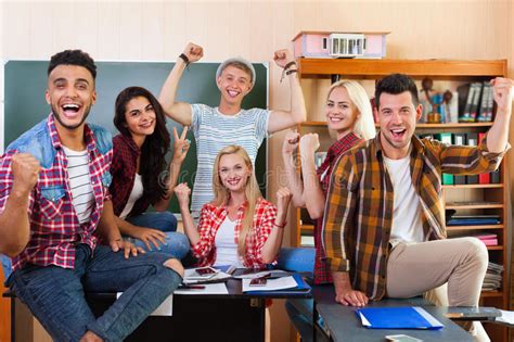 Happy Smiling Student High School Group In University Classroom