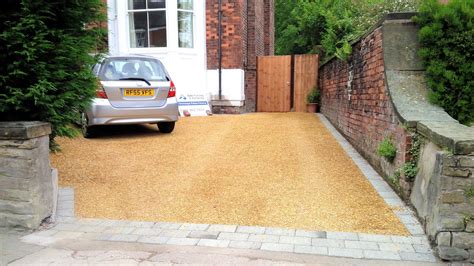 Core gravel driveway with grey tegula block borders and golden gravel in Manchester. | Gravel 