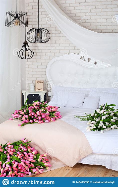 Romantic Morning In A Chic Bedroom A Large Bouquet Of Pink Tulips Lie