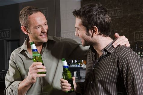 Two Men Drinking In A Bar Stock Photo Dissolve