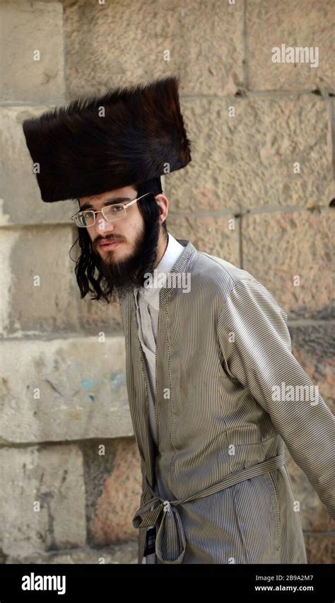 A Hasidic Jewish Man Wearing A Shtreimel Traditional Fur Hat In Mea