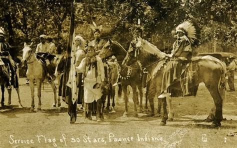 An Old Photo Of Native Americans On Horses