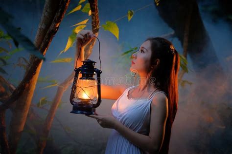 Woman With Vintage Lantern Outside At Night Cosplay Girl In Nu Stock Photo Image Of Lantern