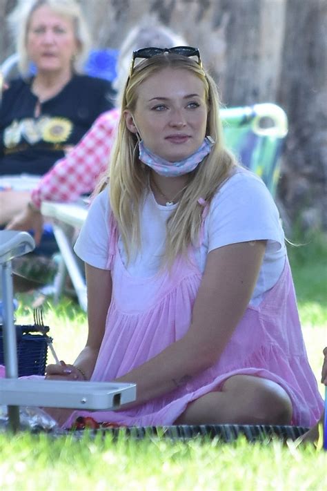 Pregnant Sophie Turner Shows Off Her Baby Bump In Pink Dress As She