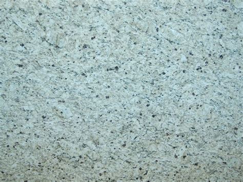As such, granite and many quartz surfaces often have very similar aesthetic qualities — speckled, neutral tones — and can sometimes be difficult to tell apart from a distance. giallo-ornamental - NEKA GRANITE MARBLE QUARTZ