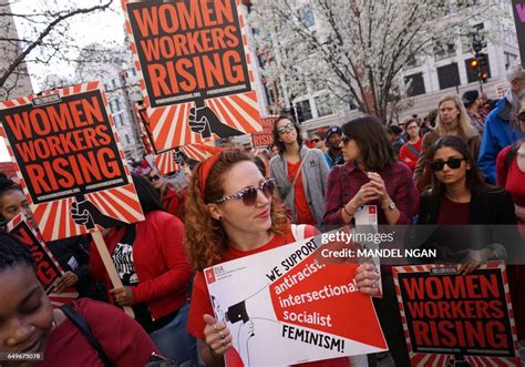 Women Hold Up Signs As They Attend A Day Without A Woman Rally News Photo Getty Images