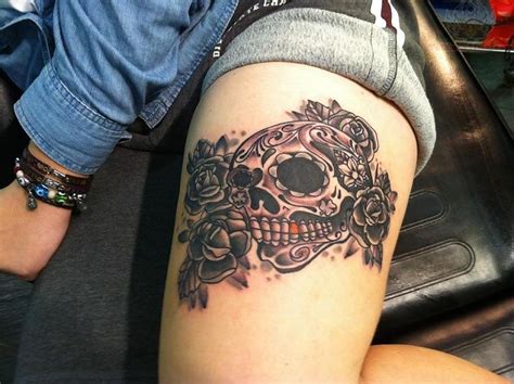 Grey Ink Roses And Sugar Skull Tattoo On Thigh
