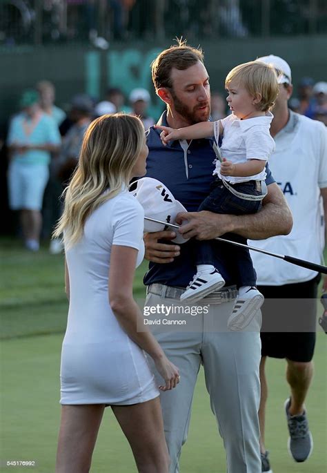 Dustin Johnson Of The United States Holds His Son Tatum As His News