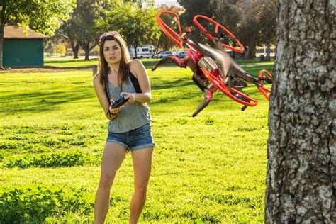 Girl Flying A Quadcopter Nano Drone Photography Articles Nano Drones