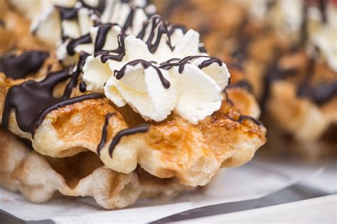 Belgian Waffles Topped With Whipped Cream And Chocolate Sauce Stock