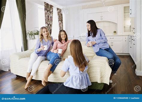 A Group Of Friends Of Young Girls Talk At A Meeting In A Room Stock