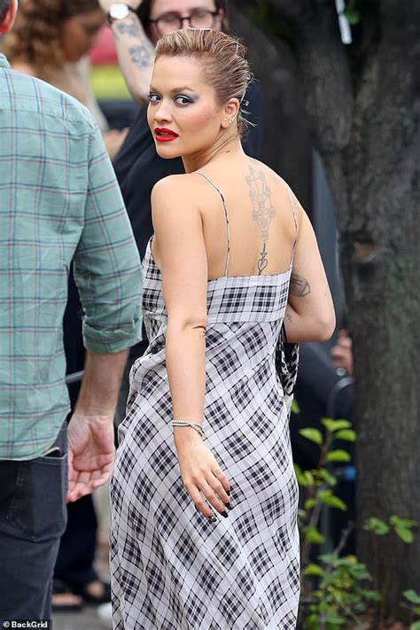 Rita Ora Shows Off Her Taut Midriff In A White Top And Black Pvc Trousers For Shoot Daily Mail