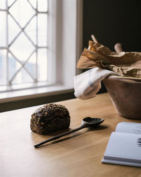 This coffee table leans into its coastal farmhouse look with natural wood finishes and a mixed material design. The Peg Leg Table | deVOL Kitchens
