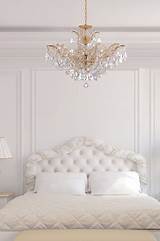 The main advantage of having white bedroom furniture is it helps relume. Maria Theresa Gold Crystal Chandelier in White Bedroom ...