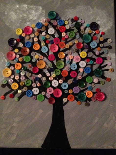 A Tree Made Out Of Buttons Is Shown In Front Of A Gray Background With