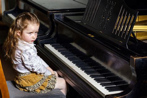 Cute Little Girl Playing Grand Piano In Music School Chakra Community