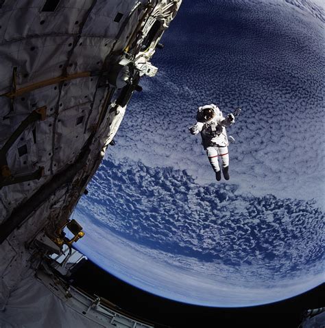 Astronaut Floating Near Satellite By Nasa© Getty Images