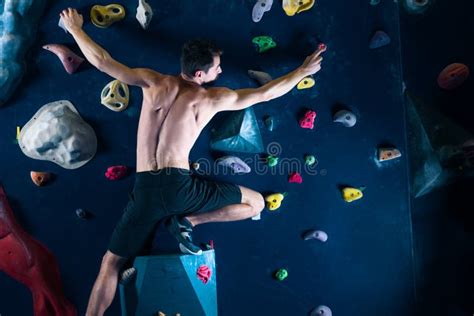 Muscle Male Man Climbing Bouldering In Training Hall Stock Photo