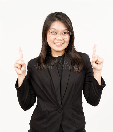 showing product and pointing up of beautiful asian woman wearing black blazer isolated on white