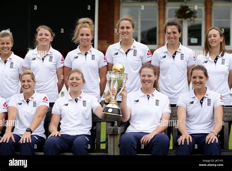The England Women Cricket Team Pose With The World Cup Trophy During A