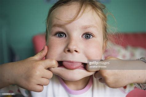 Girl Pulling Face Fingers In Mouth Portrait Closeup Photo Getty Images