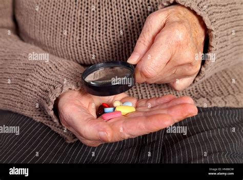 Close Up Of An Elderly Hand Holding Pills Stock Photo Alamy