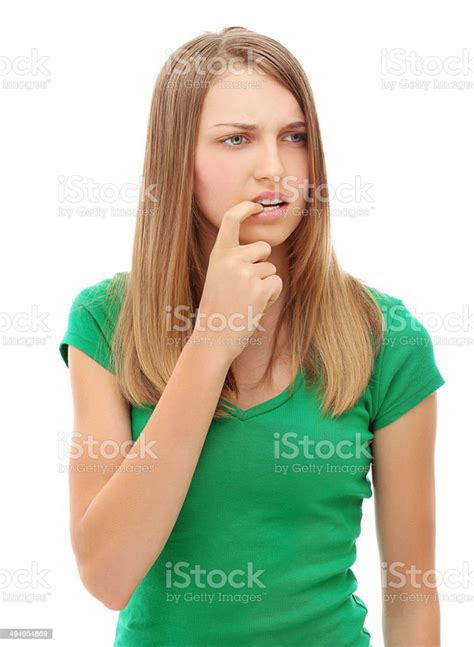 Portrait Of Nervous Woman Biting Her Nailswhite Background Stock Photo