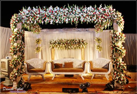 Colourful and bright stages are perfect for sangeet or mehndi nights! Pakistani Wedding Stage Decorations | Dee's Creations