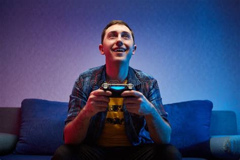 Portrait Of Crazy Playful Gamer Boy Enjoying Playing Video Games