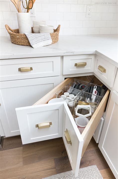 Curved base corner storage units can stow away bulky kitchen essentials such as spice racks, wine coolers and tin trays. Kitchen Cabinet Storage & Organization Ideas! | Driven by ...