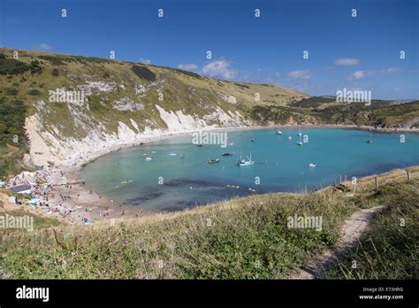 Summer Holiday Makers On The Beach At Lulworth Cove Dorset Uk Stock