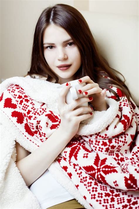 Young Pretty Brunette Woman In Her Bedroom Sitting In Christmas
