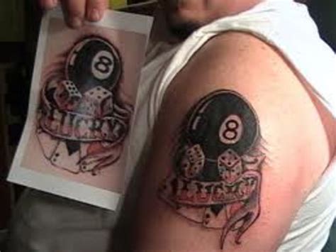 Also in front of the home, a manly figure is tattooed. Eight Ball Tattoos Ideas, Meanings, and Pictures | TatRing