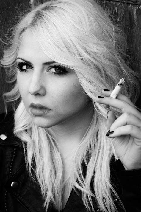 the blonde hottie smokes cigarette telegraph