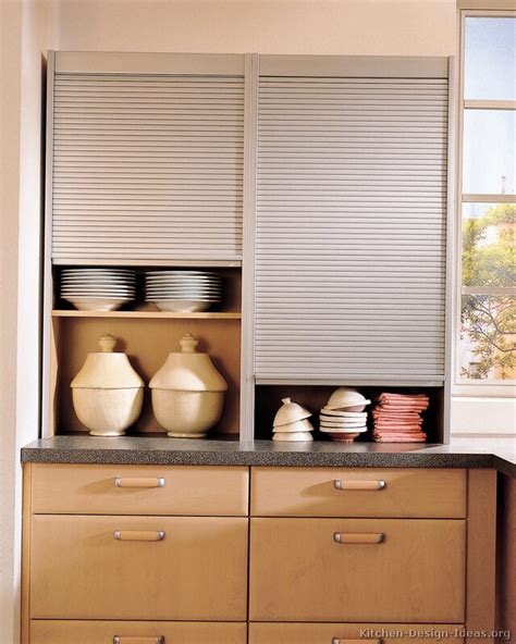 Replace cabinet doors with tambour doors that slide up out of the way for easy access to small appliances behind. kitchen-cabinet-door-style garage door tambour door ...