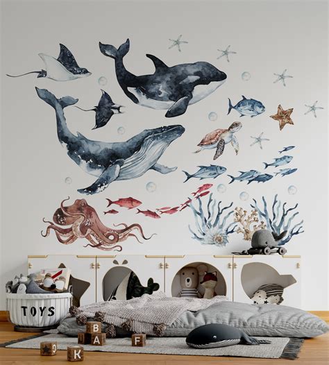 An Ocean Themed Bedroom With Dolphins And Other Marine Creatures On The