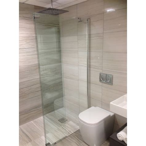 In smaller bathrooms, the tub and its frame can fill one entire wall. Small En Suite Shower room - STONEWOOD