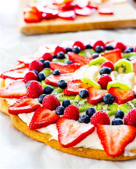 Side Shot Of A Beautiful Fruit Pizza On A Cookie Crust With Cream