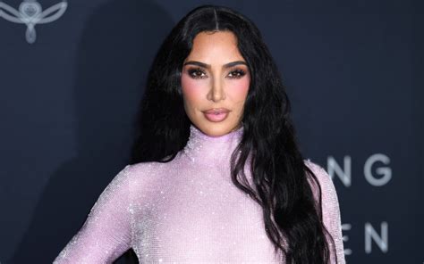 Kim Kardashians Paradise Includes Several Sandy String Bikini Pics