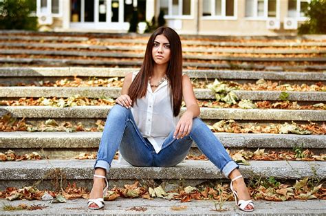 540x960 Resolution Woman Wearing Blue Jeans Sitting On Bench Hd