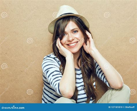 Woman Sitting In Front Of Wooden Wall Stock Photo Image Of
