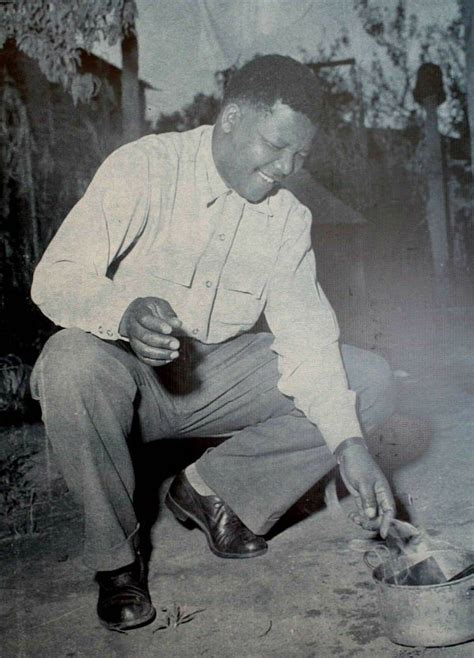 Nelson Mandela Burns His Pass Book In Protest Of Pass Laws In 1952