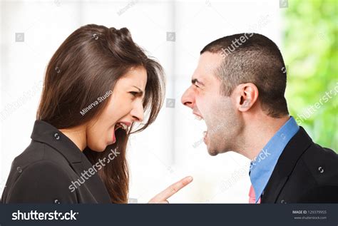 Two Persons Yelling Out To Each Other Stock Photo