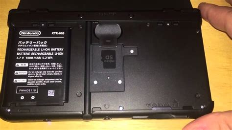 Open the sd card slot cover. New Nintendo 3DS eject SD card automatically - YouTube