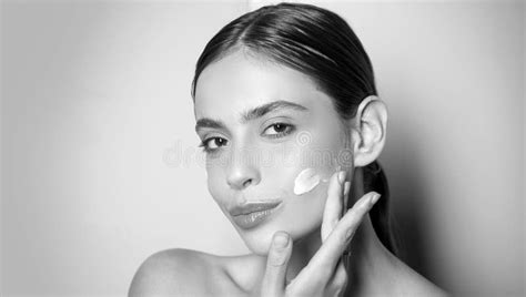 Beautiful Woman Spreading Cream On Her Face Skin Cream Concept Facial Care For Female Stock