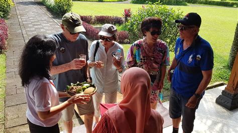 Tourists From Seabourn Encore Cruise Enjoy Traditional Drink At