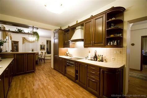 To add warmth, your best option is to go with hardwood floors, though you can also find laminate and tile flooring in brown and red tones. Pictures of Kitchens - Traditional - Dark Wood Kitchens ...