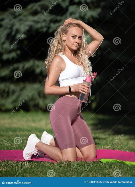 Woman With Perfect Legs Doing Sports Exercise Outdoor In The Park Stock