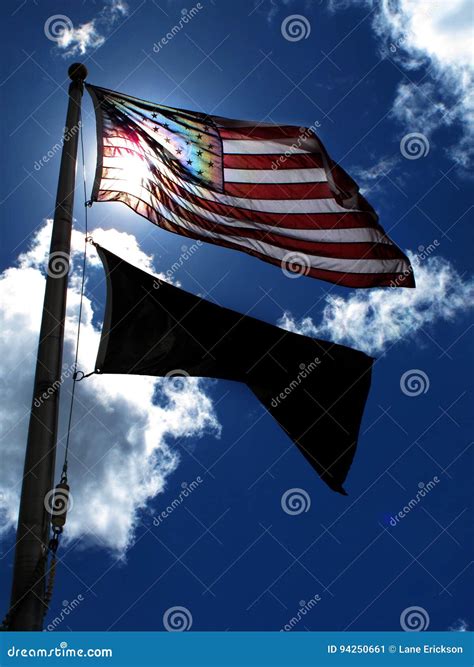 American Flag On Windy Day Sunlight Blue Sky And Clouds Stock Image